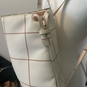 A New Day Cream and Brown Backpack with Gold Accents